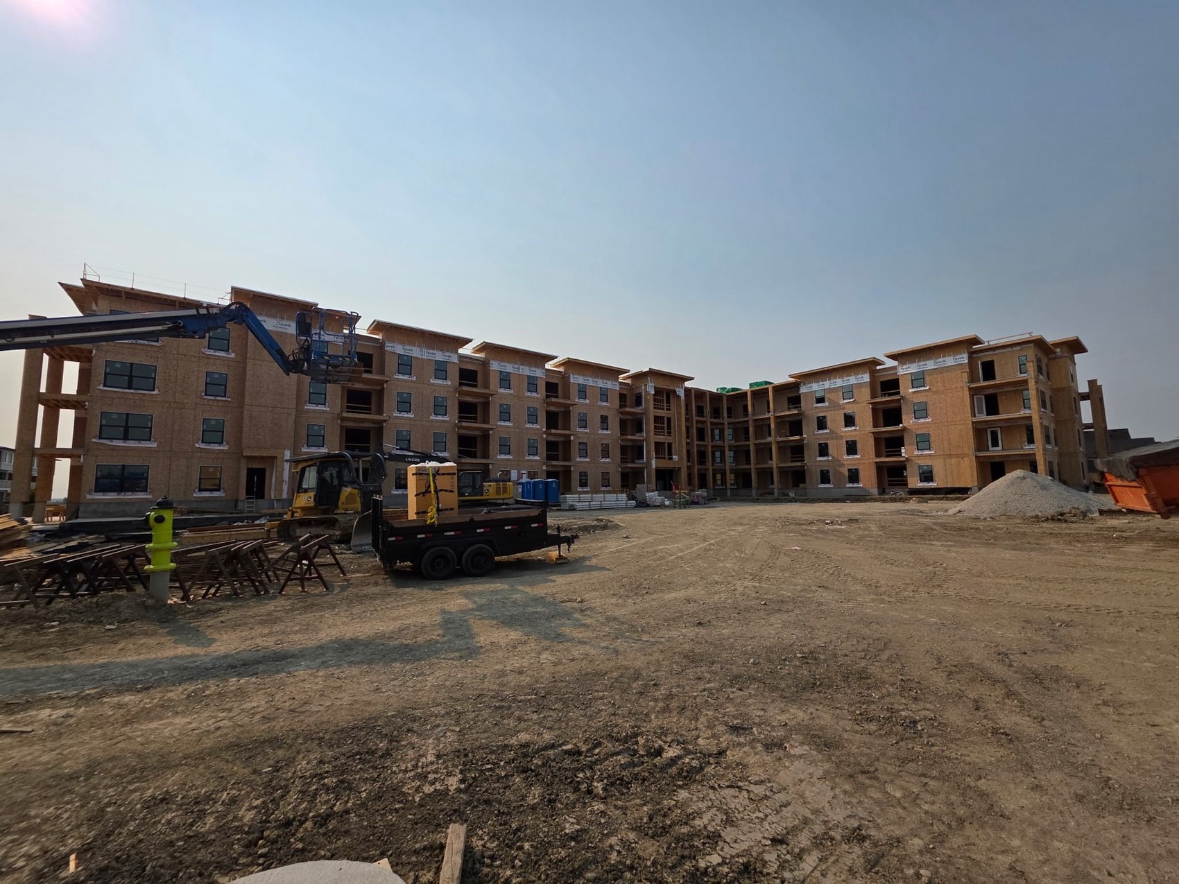 Six-storey wood-frame condo under construction — DJD vinyl decking site