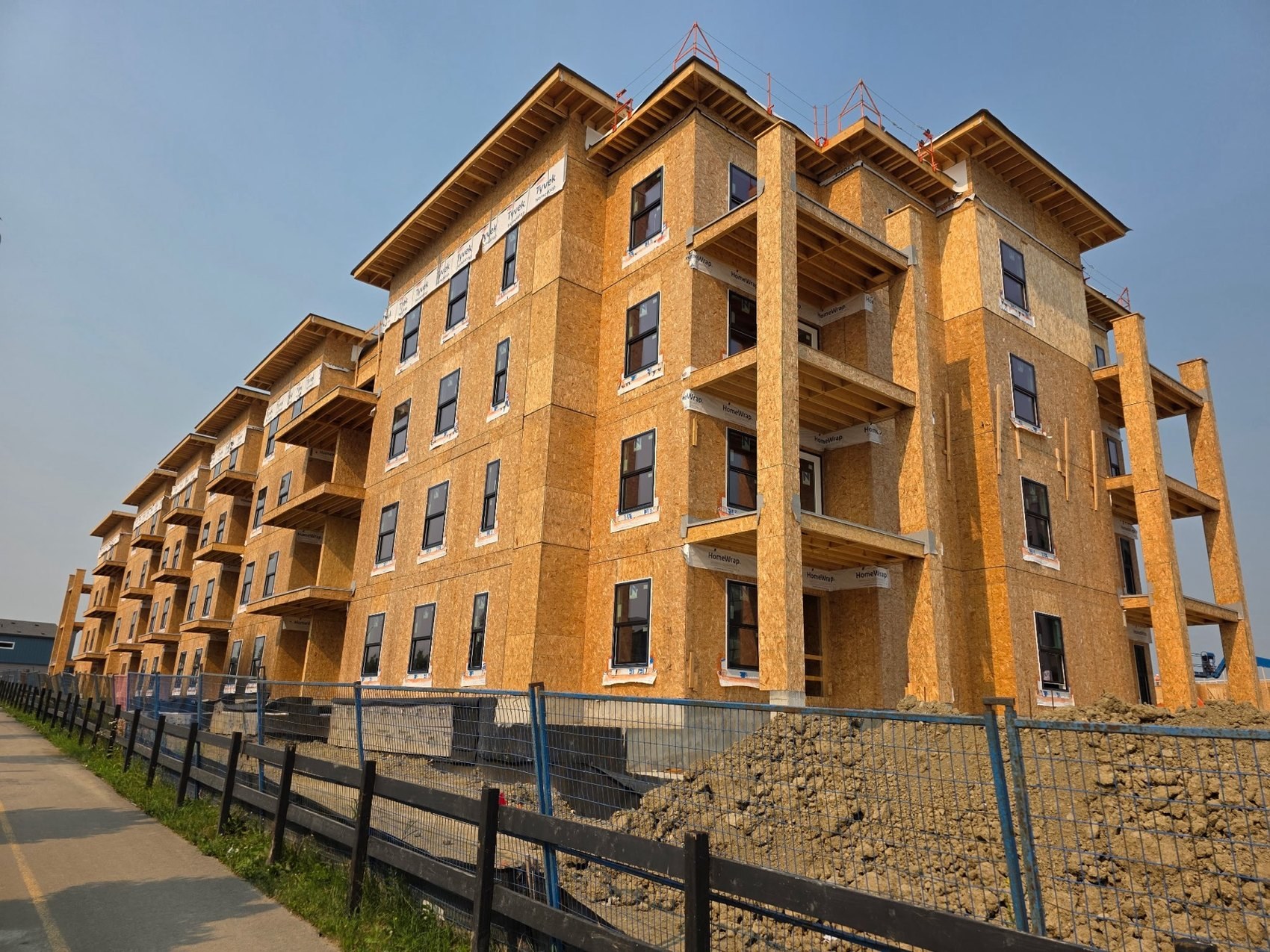 Wood-frame condo courtyard elevation under construction