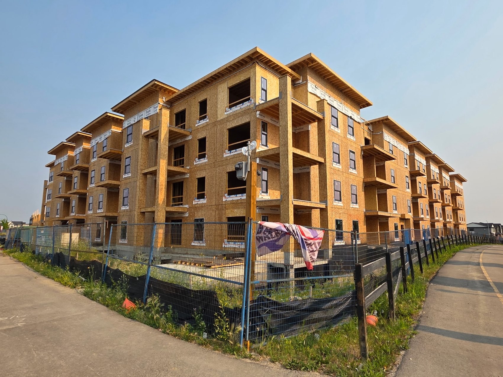 Condo building elevation with balcony framing