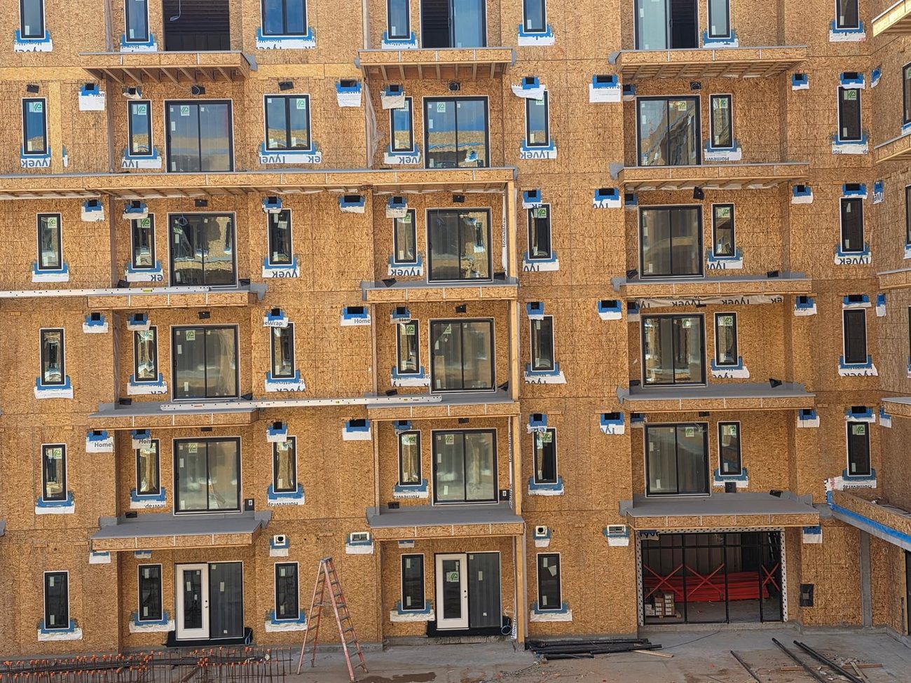 Grid of framed balconies on apartment elevation