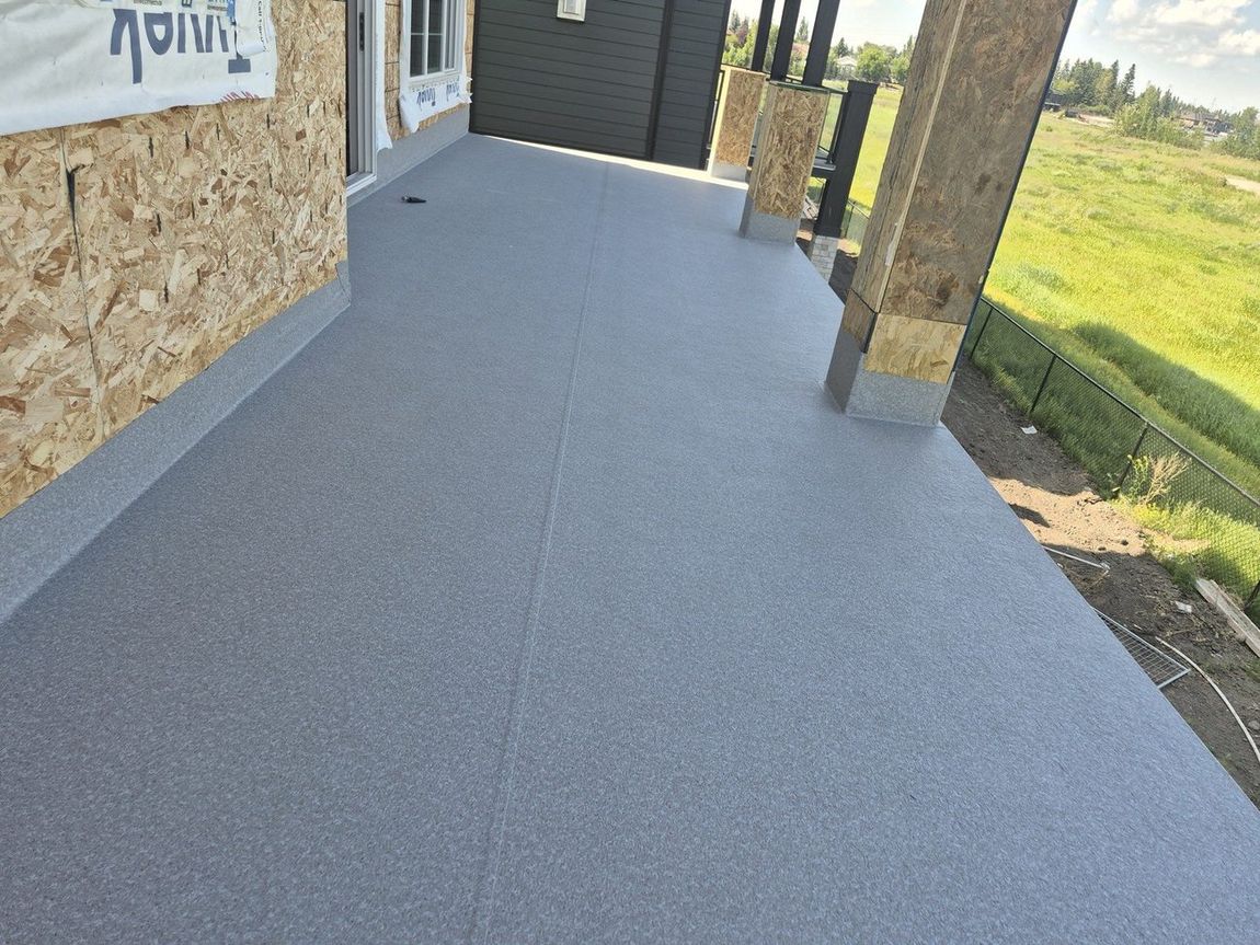 Finished granite-texture vinyl membrane deck — DJD Renovations