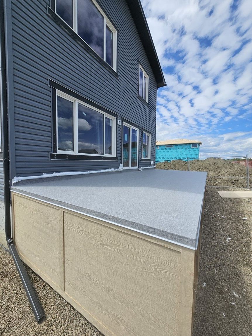 Finished granite-texture vinyl membrane deck — DJD Renovations