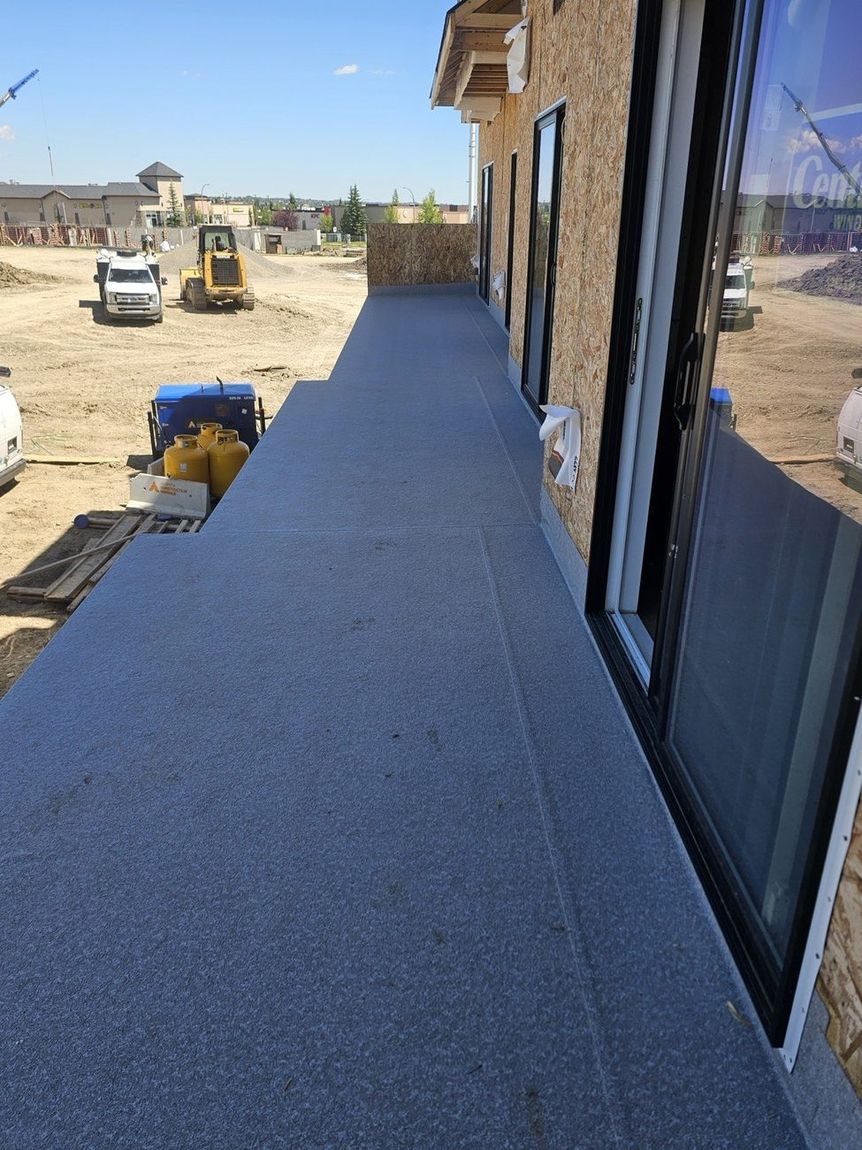 Finished granite-texture vinyl membrane deck — DJD Renovations